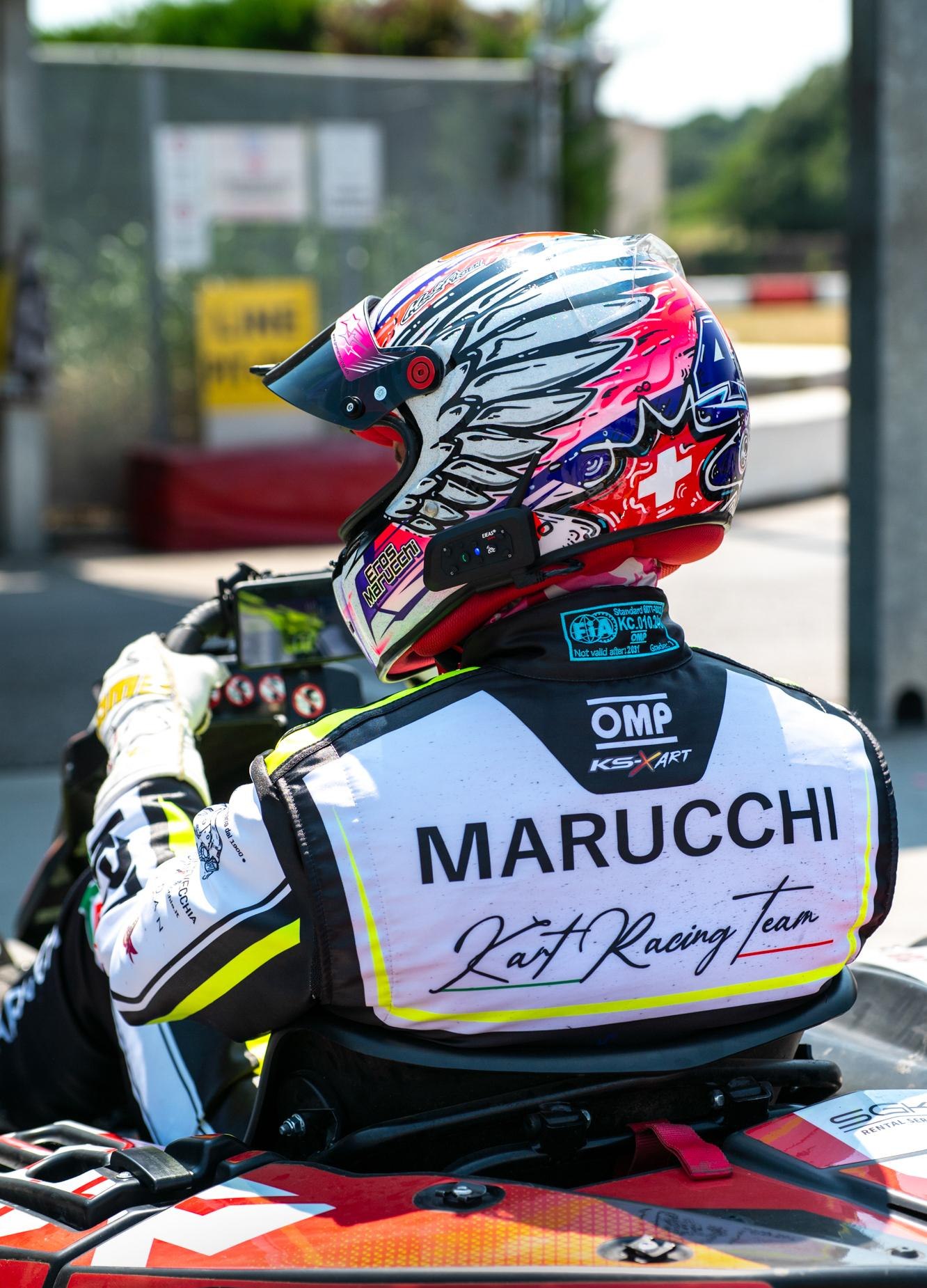 Eros Marucchi, pilota del team di karting rental PRIME Racing, con casco e tuta da gara